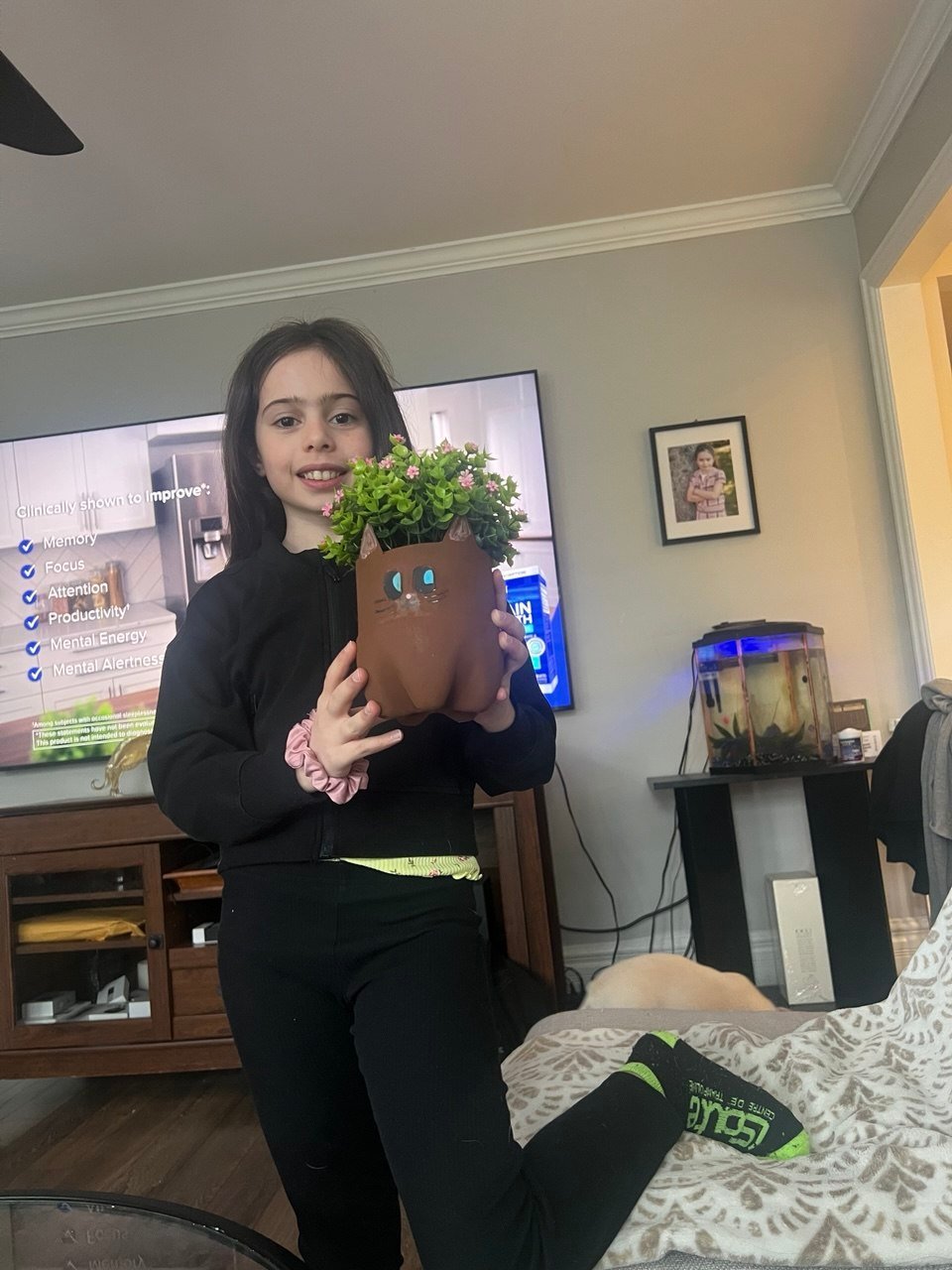 Livia, the founder of PetZPotz, holding Whiskers